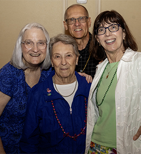 Group smiling at Summer Salute event