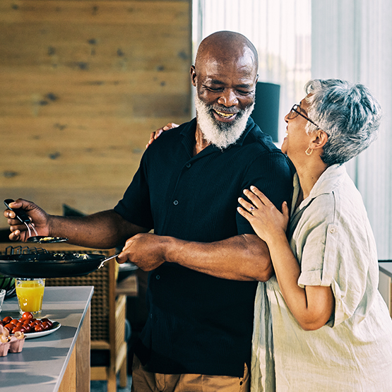 Couple cooking in kitchen